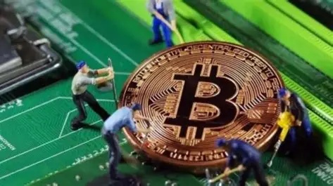A dedicated miner operating advanced hardware, symbolizing the human element in cryptocurrency extraction